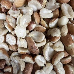 Assorted raw peanuts closeup.