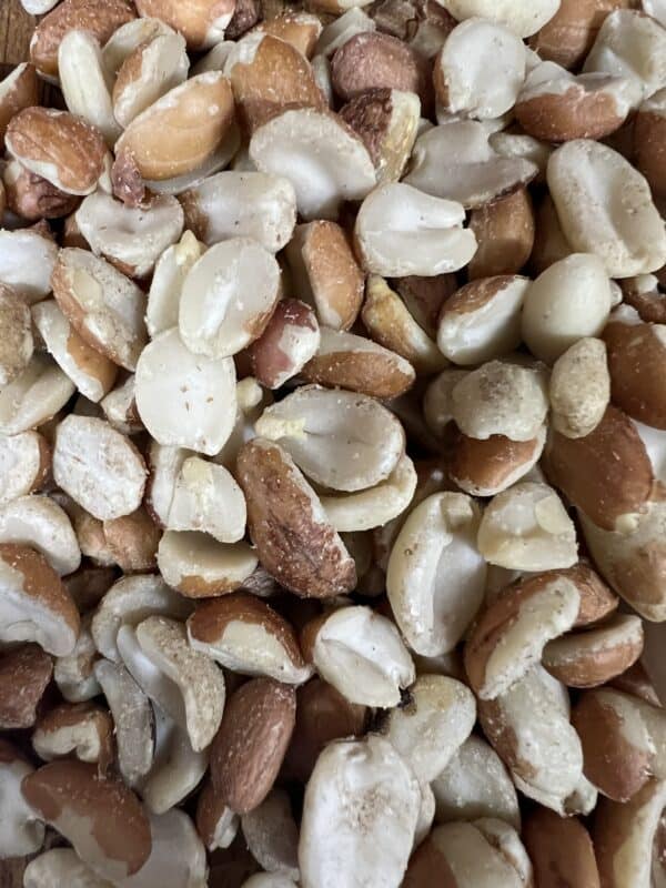 Assorted raw peanuts closeup.